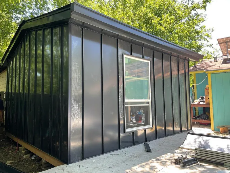 Black standing seam metal wall panels for Roof Inspection in Collierville